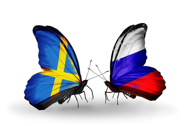 Two butterflies with flags on wings as symbol of relations Sweden and Russia — Stock Photo, Image