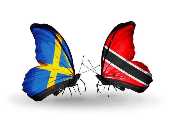 Due farfalle con bandiere sulle ali come simbolo delle relazioni Svezia e Trinidad e Tobago — Foto Stock