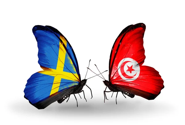 Two butterflies with flags on wings as symbol of relations Sweden and Tunisia — Stock Photo, Image