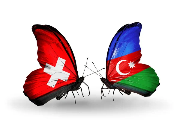 Dos mariposas con banderas de Suiza y Azerbaiyán en alas — Foto de Stock