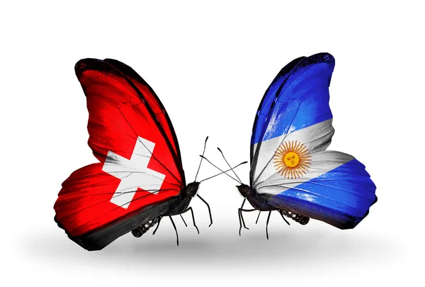 Deux papillons avec des drapeaux de Suisse et d'Argentine sur les ailes — Photo