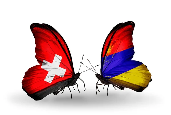 Duas borboletas com bandeiras da Suíça e Armênia em asas — Fotografia de Stock