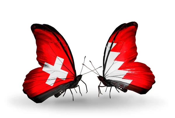 Dos mariposas con banderas de Suiza y Bahréin en alas — Foto de Stock