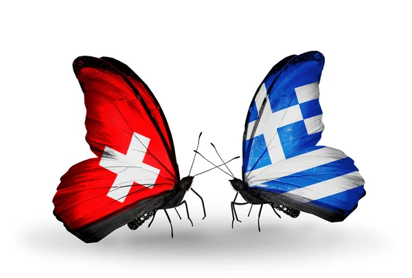 Two butterflies with flags of Switzerland and Greece on wings — Stock Photo, Image