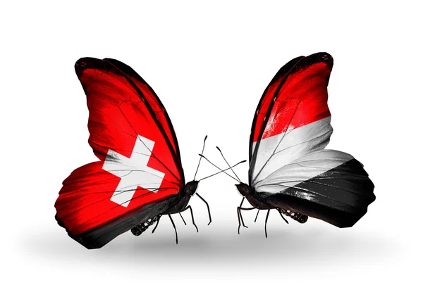 Δύο πεταλούδες με σημαίες της Ελβετίας και Υεμένη με φτερά — Φωτογραφία Αρχείου