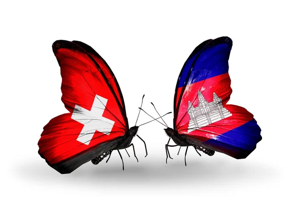 Due farfalle con bandiere di Svizzera e Cambogia sulle ali — Foto Stock
