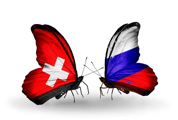 Dos mariposas con banderas de Suiza y Rusia en alas —  Fotos de Stock