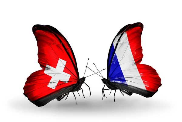 2 つの蝶の翼上のフラグと関係の象徴としてスイス連邦共和国そしてフランス — ストック写真