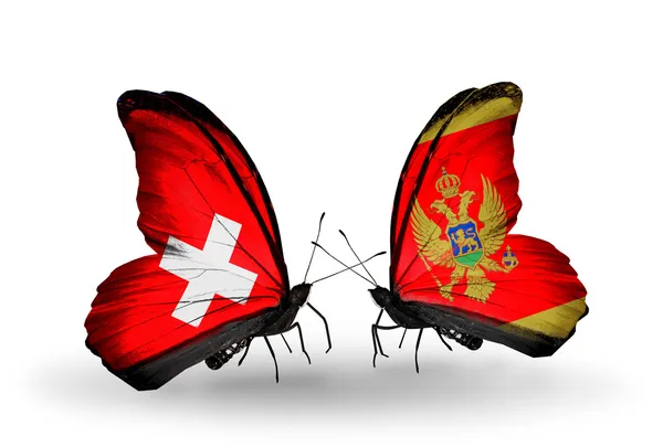 Dos mariposas con banderas en alas como símbolo de relaciones Suiza y Montenegro — Foto de Stock