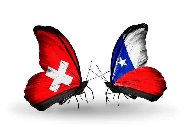 Deux papillons avec des drapeaux sur les ailes comme symbole des relations Suisse et Chili — Photo