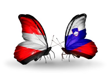 iki kelebek kanatları üzerinde Avusturya ve Slovenya bayraklı