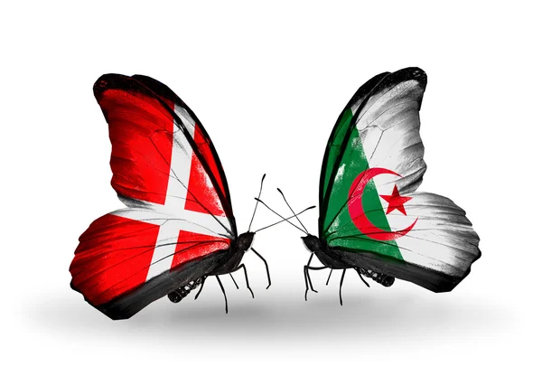 Duas borboletas com bandeiras da Dinamarca e Argélia em asas — Fotografia de Stock