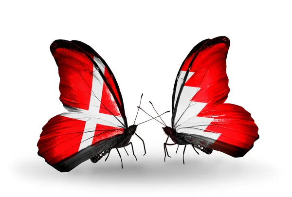 Two butterflies with flags of Denmark and Bahrain on wings — Stock Photo, Image