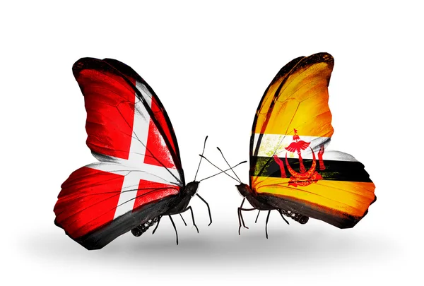 Two butterflies with flags of Denmark and Brunei on wings — Stock Photo, Image