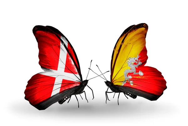 Two butterflies with flags of Denmark and Bhutan on wings — Stock Photo, Image