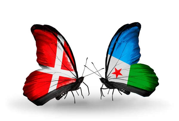 Due farfalle con le bandiere della Danimarca e Gibuti sulle ali — Foto Stock