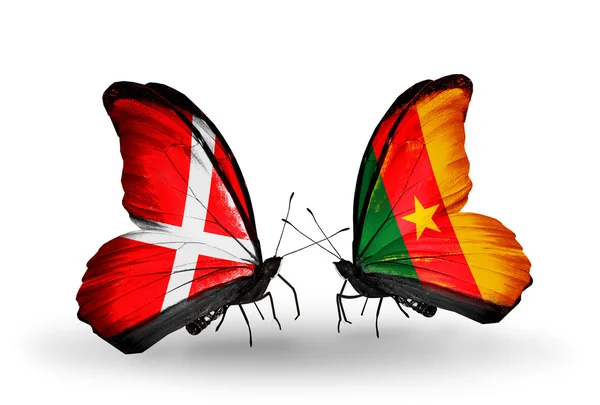 Two butterflies with flags of Denmark and Cameroon on wings — Stock Photo, Image