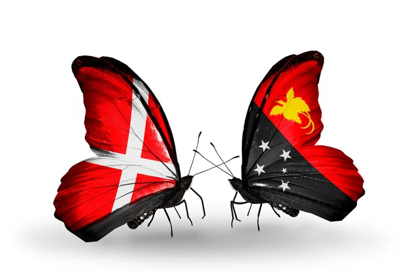 Two butterflies with flags of Denmark and Papua New Guinea on wings — Stock Photo, Image