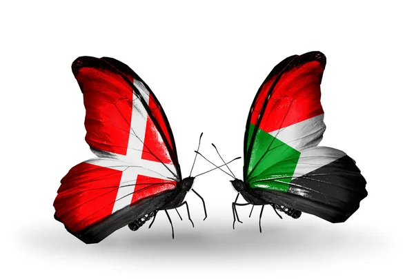 Два метеликів з прапорами Данії та Судан на крилах — стокове фото