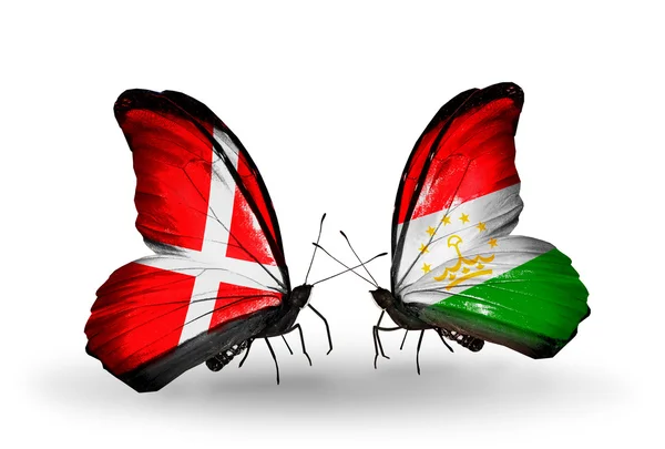 Two butterflies with flags of Denmark and Tajikistan on wings — Stock Photo, Image