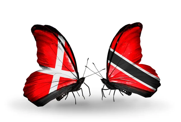 Dos mariposas con banderas de Dinamarca y Trinidad y Tobago en alas —  Fotos de Stock