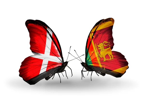 Dwa motyle z flagami dania i sri Lanki na skrzydłach — Zdjęcie stockowe