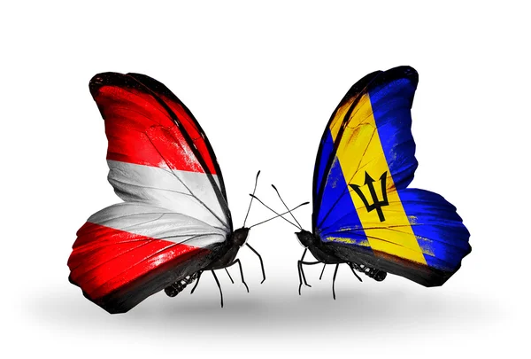 Dwa motyle z flagami Austrii i Barbadosu na skrzydłach — Zdjęcie stockowe