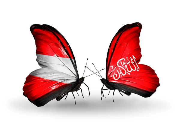 Δύο πεταλούδες με σημαίες της Αυστρίας και Βαζιριστάν με φτερά — Φωτογραφία Αρχείου