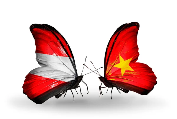Dos mariposas con banderas de Austria y Vietnam en alas —  Fotos de Stock