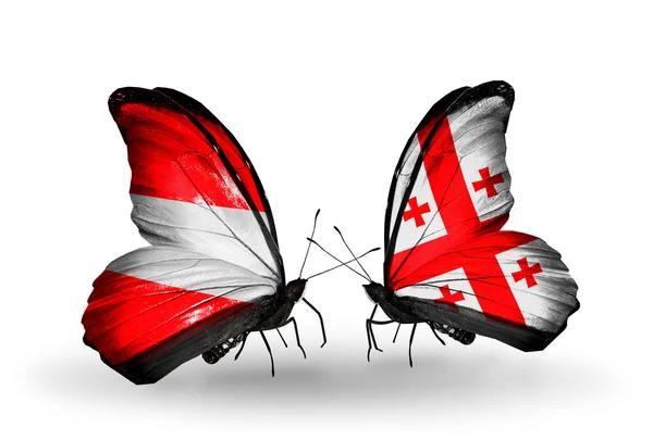 Two butterflies with flags of Austria and Georgia on wings — Stock Photo, Image