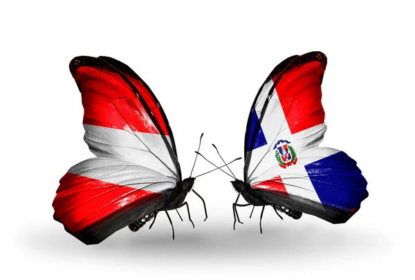 Two butterflies with flags of Austria and Dominicana on wings — Stock Photo, Image