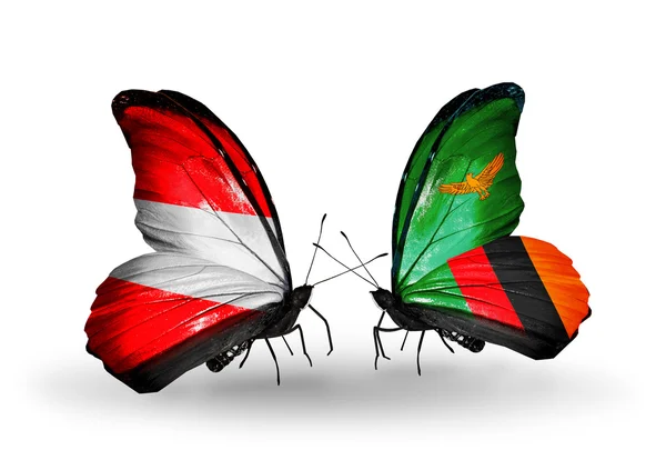 Two butterflies with flags of Austria and Zambia on wings — Stock Photo, Image