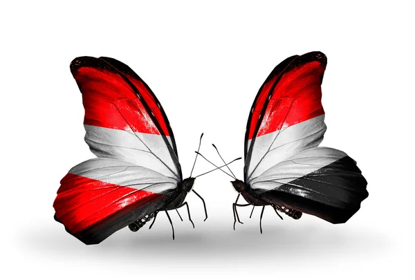 Dos mariposas con banderas de Austria y Yemen en alas —  Fotos de Stock