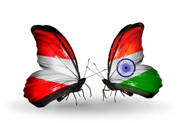 Two butterflies with flags of Austria and India on wings — Stock Photo, Image