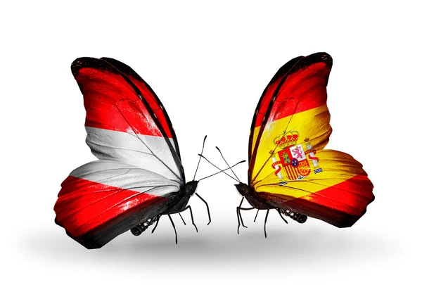 Dos mariposas con banderas de Austria y España en alas — Foto de Stock
