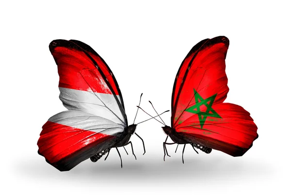 Dwa motyle z flagami Austrii i Maroko na skrzydłach — Zdjęcie stockowe