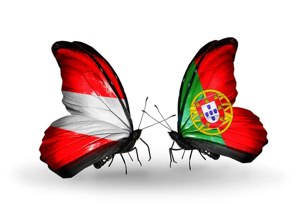 Two butterflies with flags of Austria and Portugal on wings — Stock Photo, Image