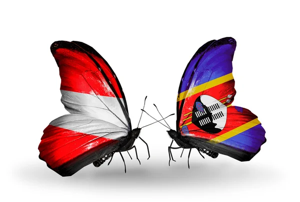 Two butterflies with flags of Austria and Swaziland on wings — Stock Photo, Image