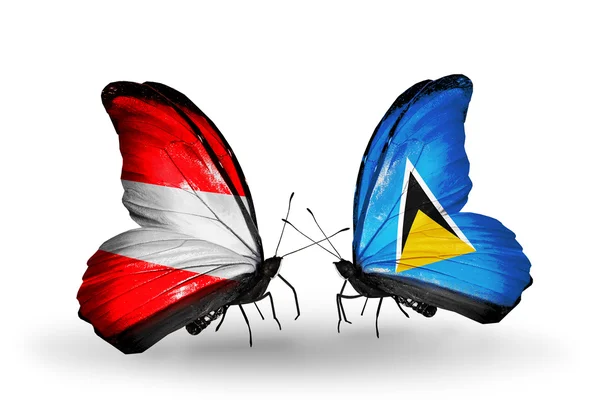 Two butterflies with flags of Austria and Saint Lucia on wings — Stock Photo, Image