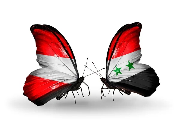 Duas borboletas com bandeiras da Áustria e Síria em asas — Fotografia de Stock