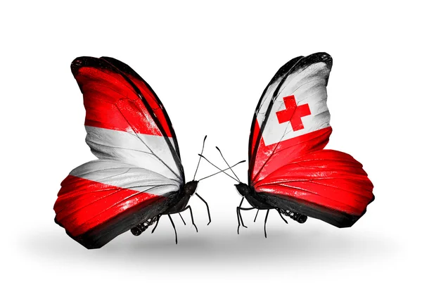 Dva motýli s vlajkou Rakouska a tonga na křídlech — Stock fotografie
