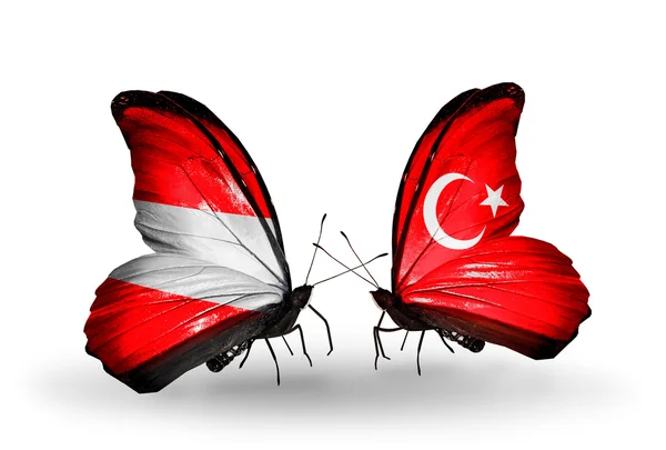 Two butterflies with flags of Austria and Turkey on wings — Stock Photo, Image