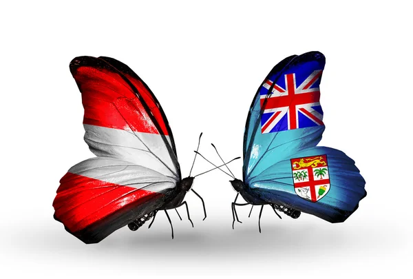 Duas borboletas com bandeiras da Áustria e Fiji em asas — Fotografia de Stock