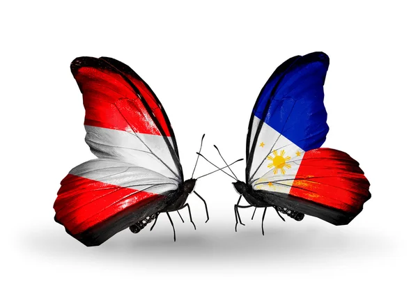 Deux papillons avec des drapeaux de l'Autriche et des Philippines sur les ailes — Photo