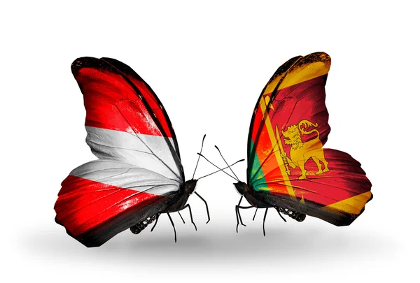 Iki kelebek kanatları üzerinde Avusturya ve sri lanka bayrağı ile — Stok fotoğraf