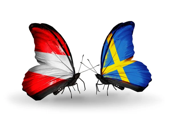 Two butterflies with flags of Austria and Sweden on wings — Stock Photo, Image