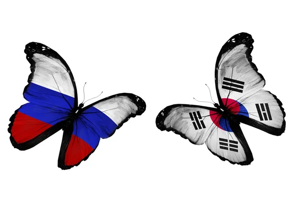 Two butterflies with Russia and South Korea flags flying — Stock Photo, Image