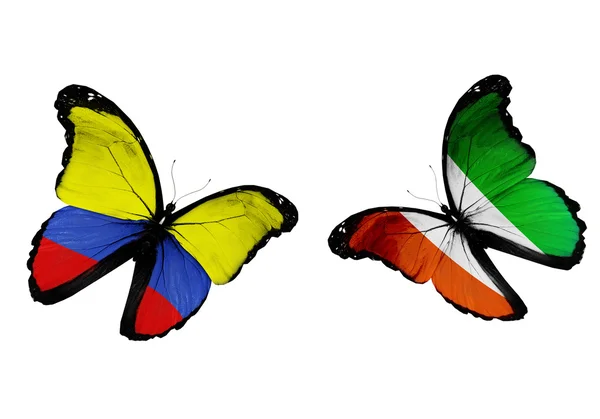 飛行コロンビアとコートのコートジボアール フラグと 2 匹の蝶 — ストック写真