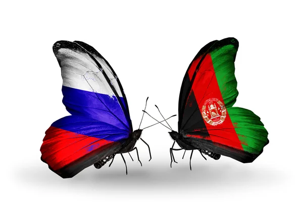 Deux papillons avec des drapeaux de la Russie et de l'Afghanistan sur les ailes — Photo