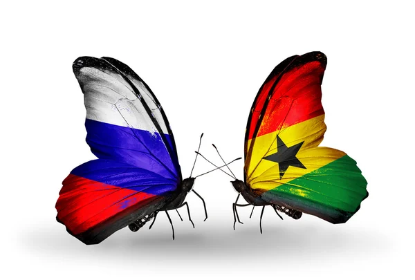 Deux papillons avec des drapeaux de la Russie et du Ghana sur les ailes — Photo